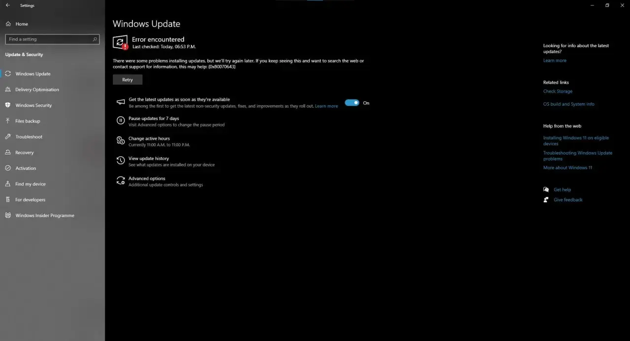 Błąd 0x80070643 podczas aktualizacji systemu Windows. Widok okna z komunikatem o błędzie i opcjami ponowienia próby.