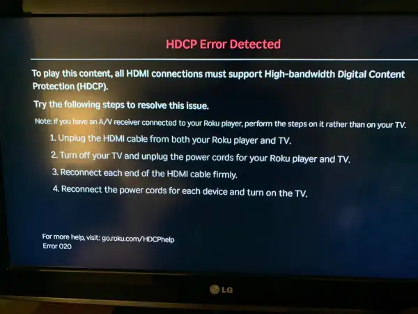 Komunikat błędu HDCP na ekranie telewizora z instrukcjami rozwiązywania problemu.